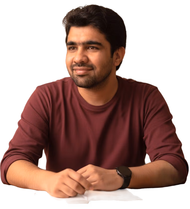 Raza Dotani writing in a notebook.